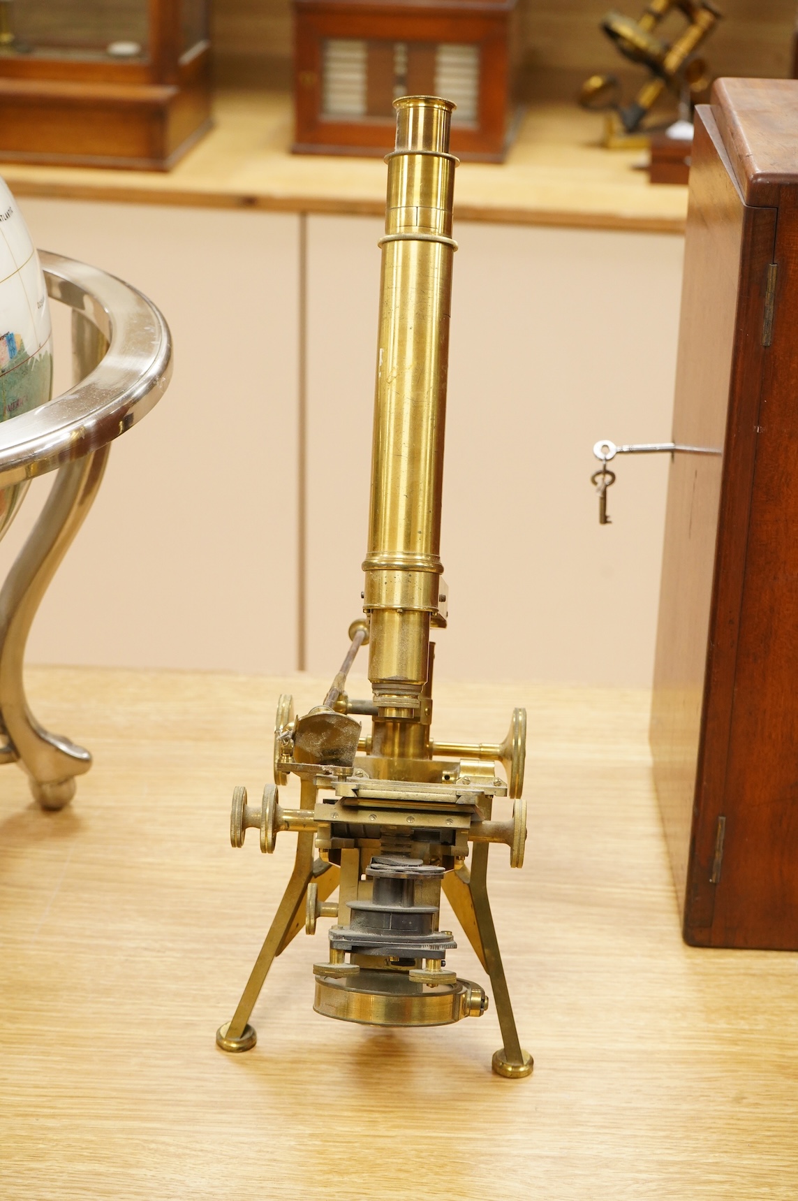 A fine mid 19th century brass compound monocular microscope, by Powell and Lealand, 170, Euston Road, London, dated 1869, mahogany cased, together with a mahogany cased accessory box, containing - 7 objectives, 4 Leiberk